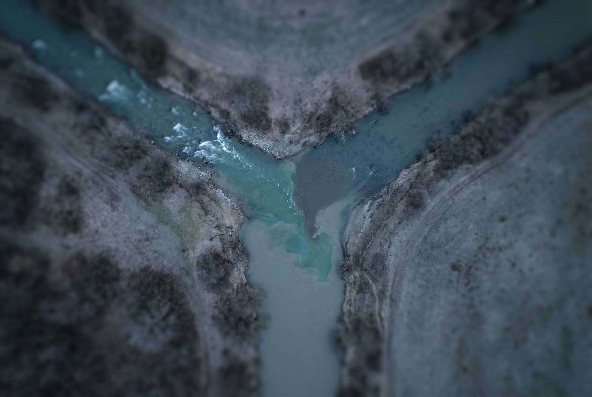 Aerial view of two rivers merging into one channel